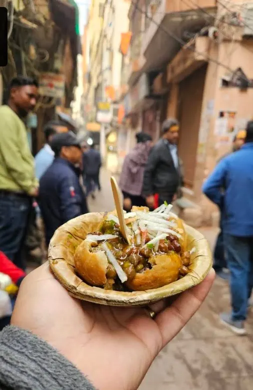 Aloo kachori chana served in a leaf bowl at The Ram Bhandar